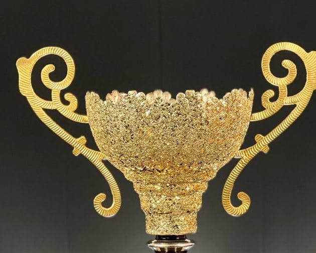 Glory Cup: gold filigree bowl with scrolled handles against black