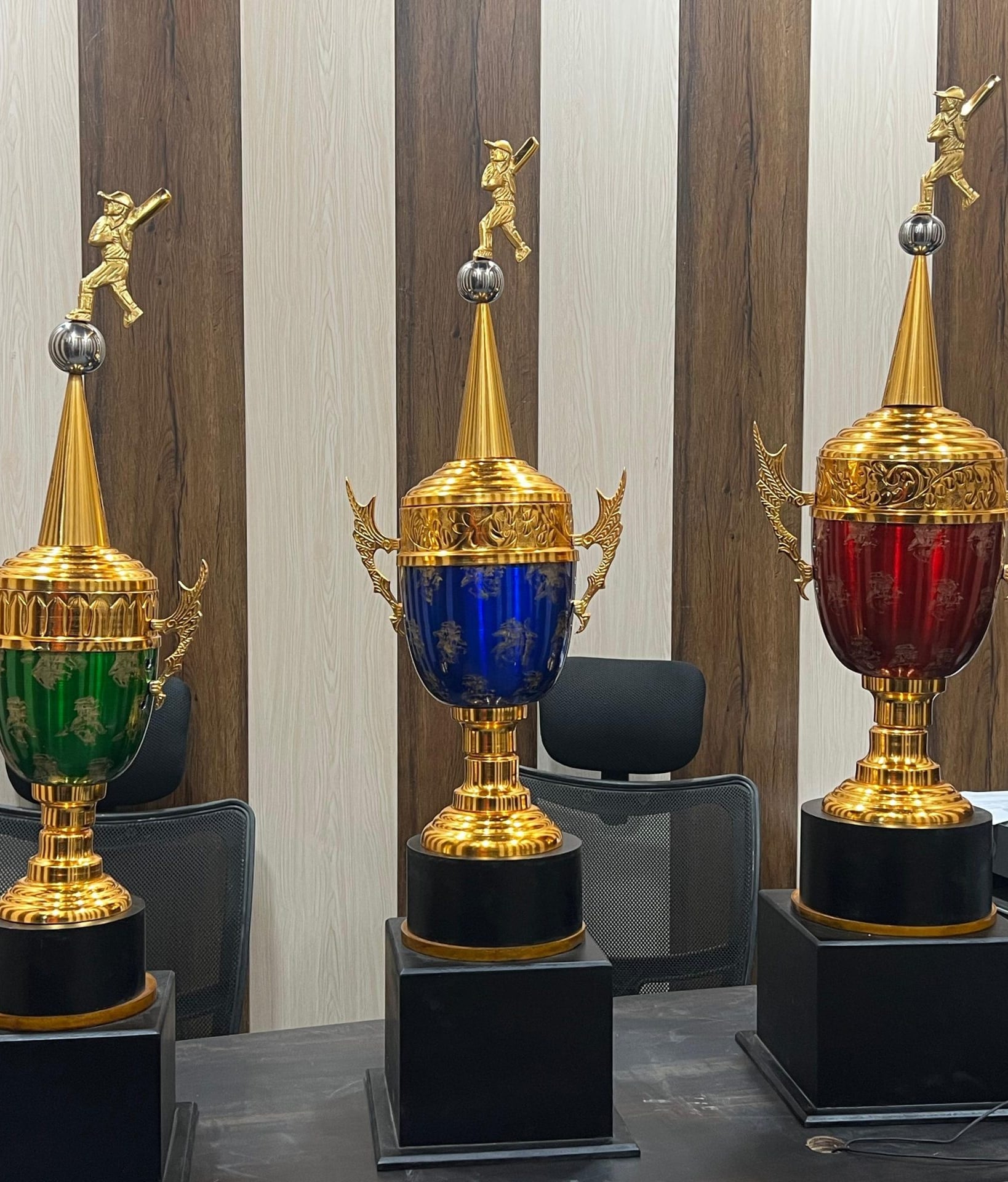 Dragon Mini cups in green, blue and red enamel with cricketer figures on gold spires